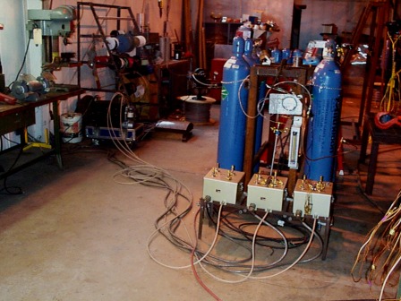 The vacuum pump/power supply, quads (transducers), and
					 calibration gases